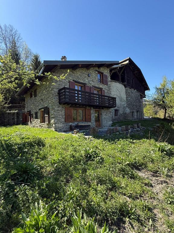 an old stone house on top of a hill at Chalet coeur d'alpage La Plagne Les Arcs in La Plagne Tarentaise