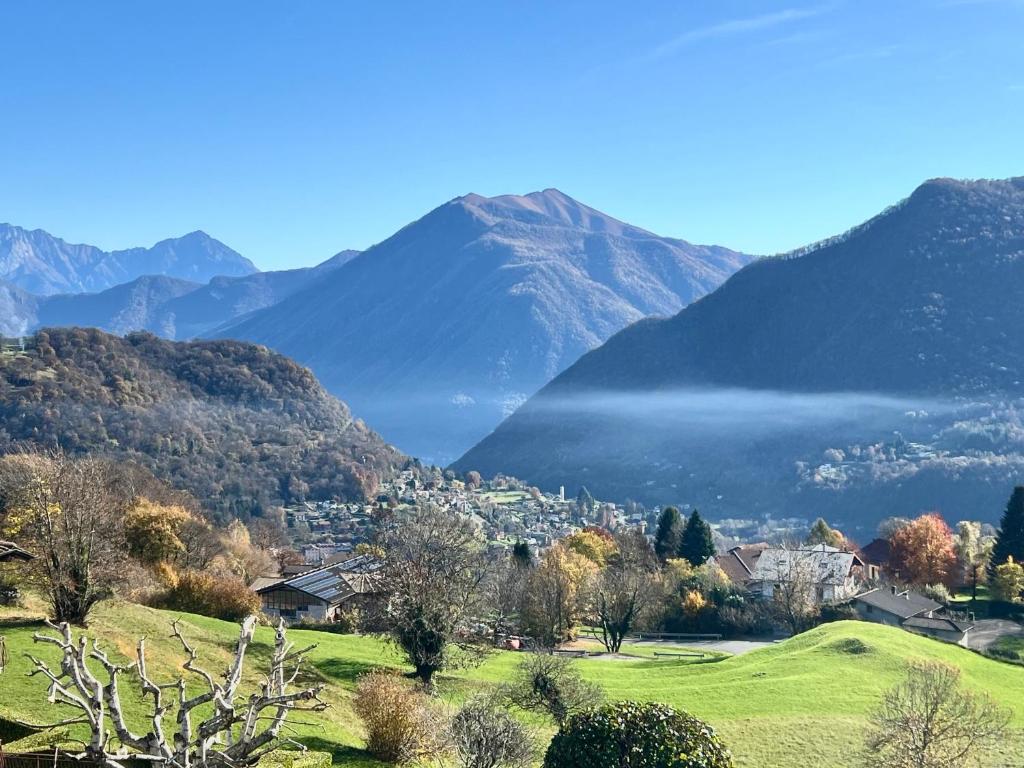 a town in a valley with mountains in the background at Chalet San Primo in Castiglione dʼIntelvi