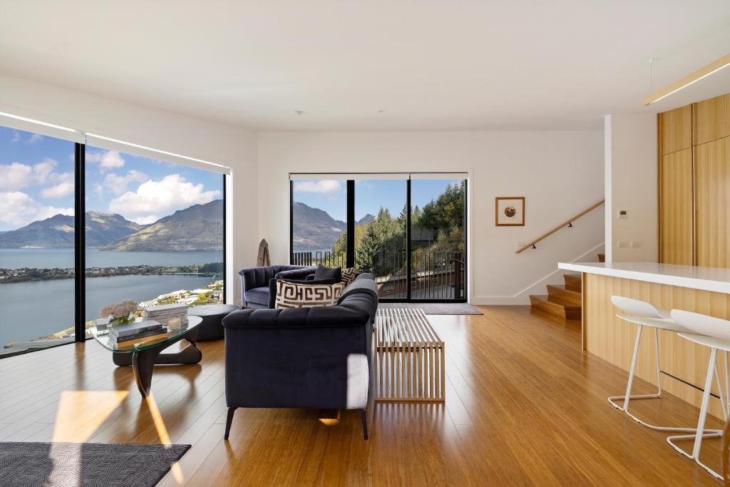 a living room with a couch and a table at No.8 Queenstown in Queenstown