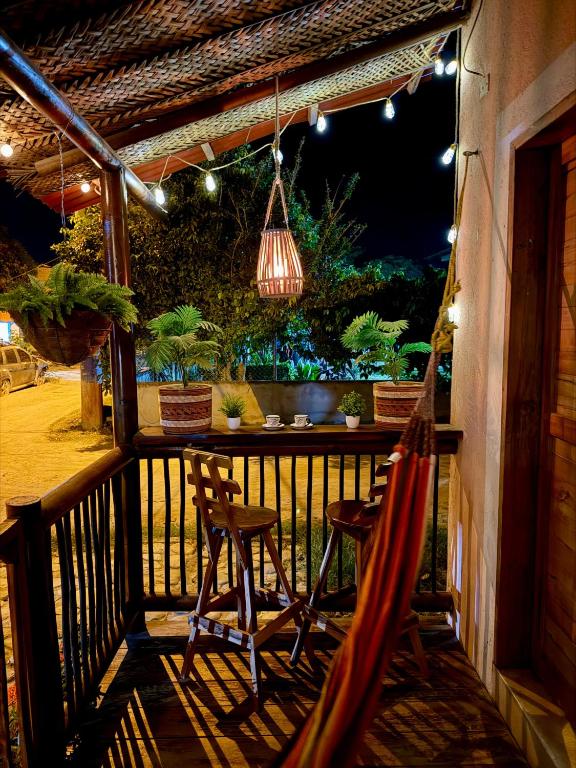 a porch with a hammock and a table and chairs at Apartaestudio Privado con cocina in Palomino