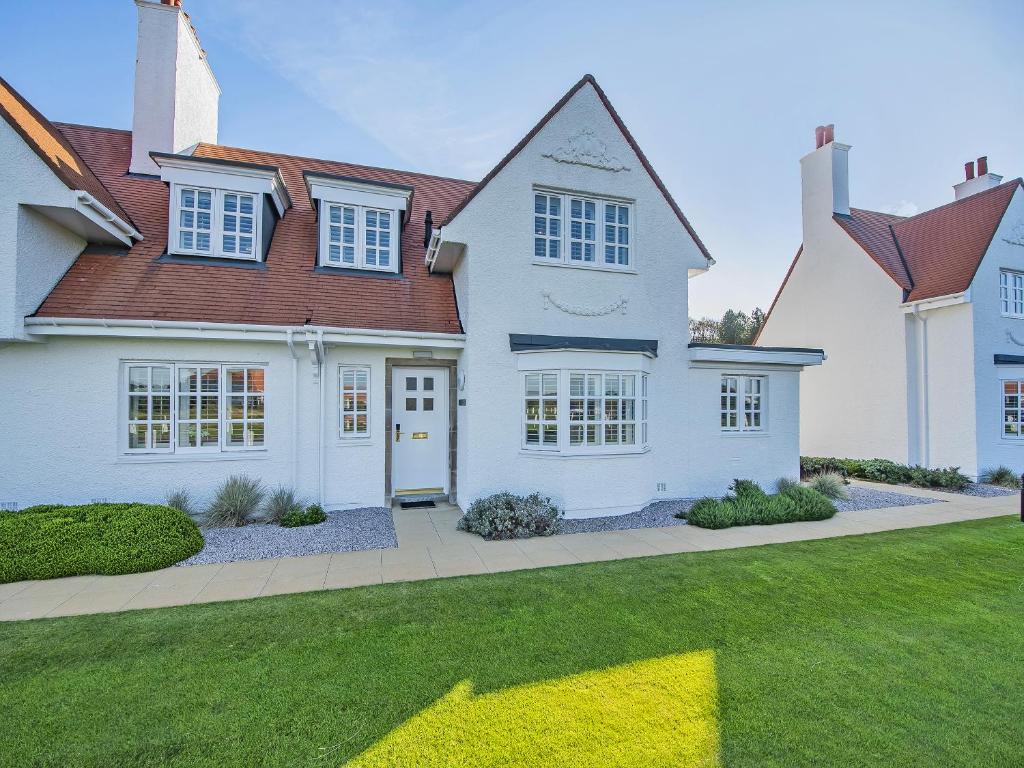a large white house with a brown roof at Royal Aberdeen - Ukc6917 in Turnberry
