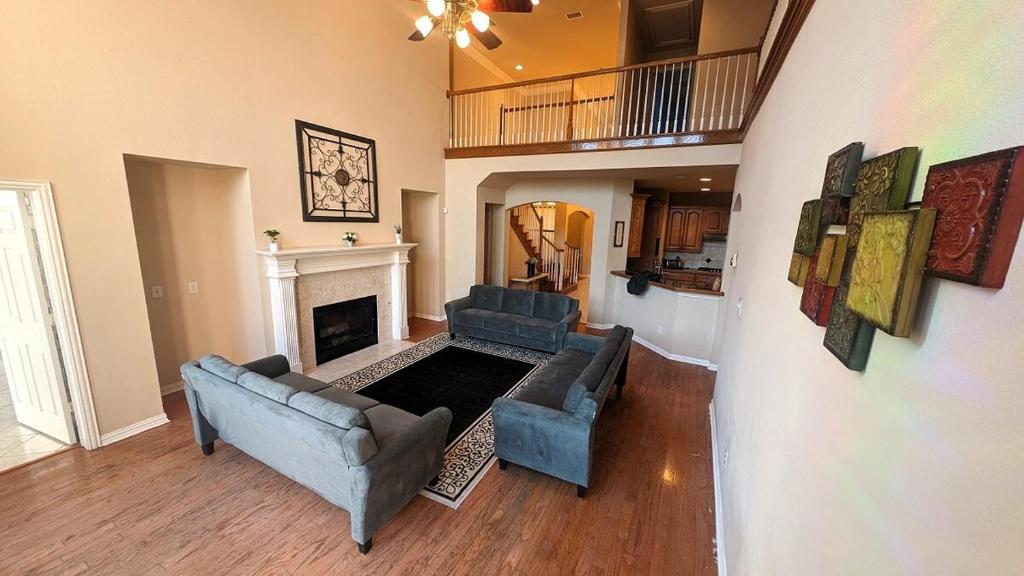 a living room with two couches and a fireplace at Elegant, comfy, a retreat with Pool in Garland