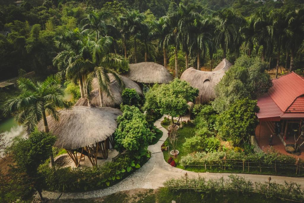 an aerial view of a resort with trees and a road at Bamboo Hill in Lương Sơn