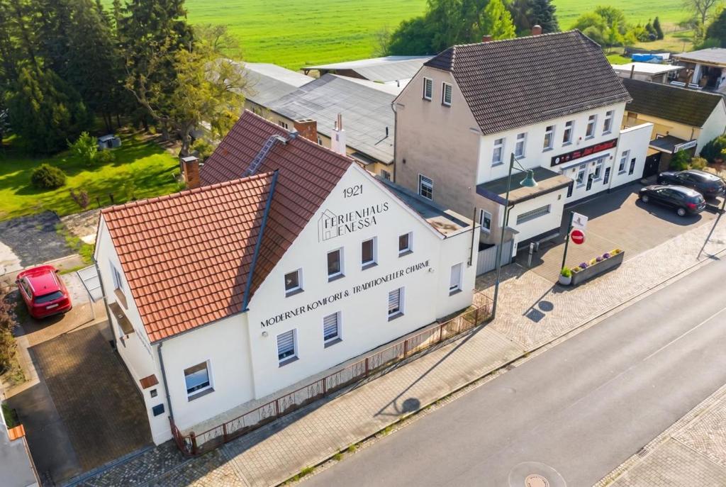 an overhead view of a white building on a street at Ferienhaus Enessa in Lauchhammer