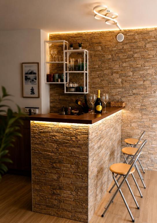 a bar in a room with a brick wall at Spa & Relax in Cairo Montenotte
