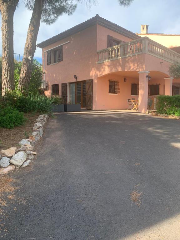 a house with a driveway in front of it at Location Frejus in Fréjus