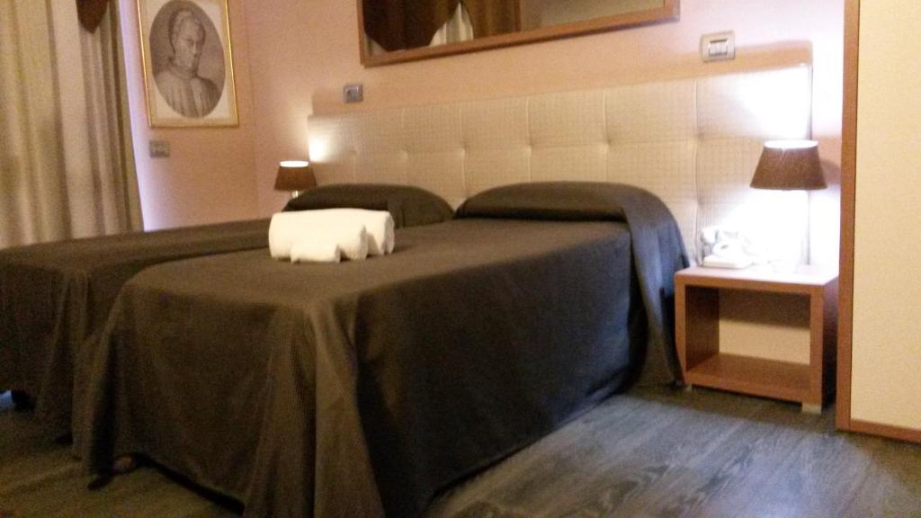 Łóżko lub łóżka w pokoju w obiekcie Hotel Antica Tabaccaia Resort