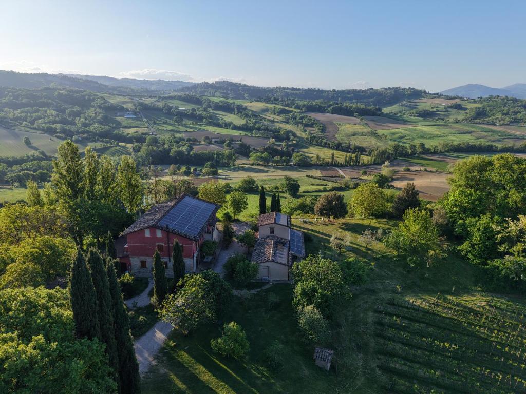 an aerial view of a house in a field at Boutique Bio Agriturismo Casale San Cristoforo in Città di Castello