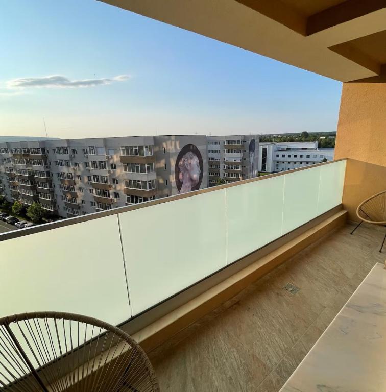 a balcony with a view of a city at Soho Apartment Fial in Bacău