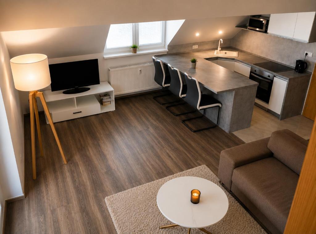 a small living room with a couch and a kitchen at Apartmán Urban Kubín in Dolný Kubín