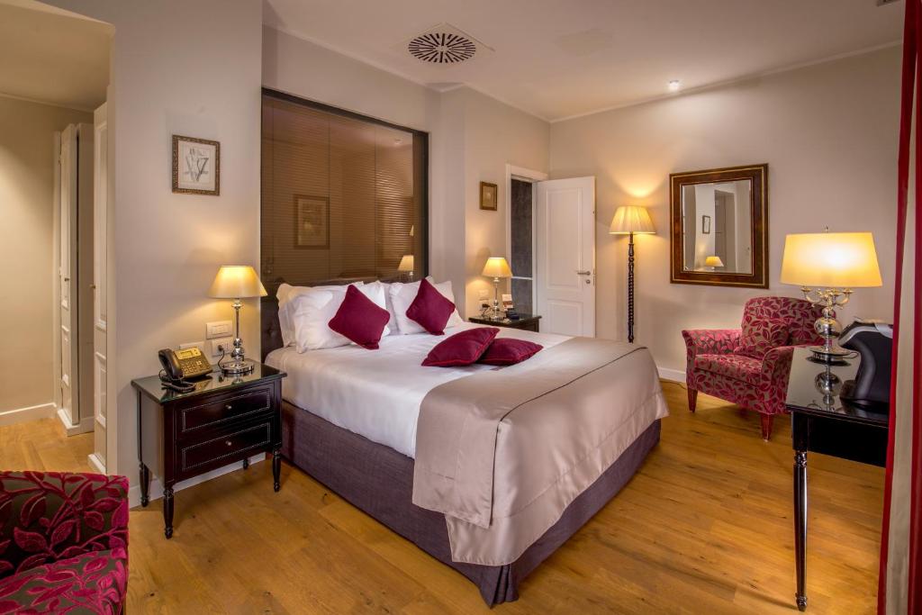 Postel nebo postele na pokoji v ubytování Hotel Monte Cenci
