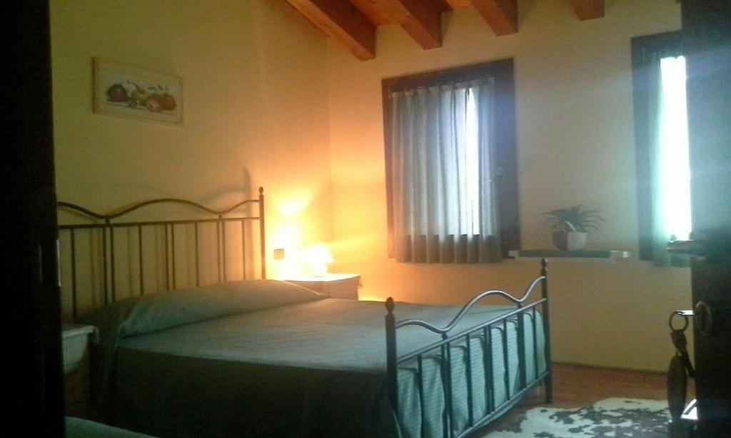 Postel nebo postele na pokoji v ubytování Agriturismo La Prateria