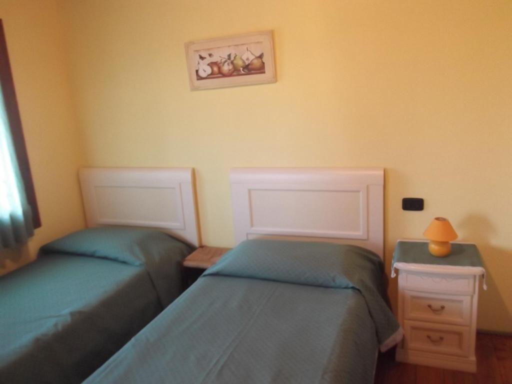 Postel nebo postele na pokoji v ubytování Agriturismo La Prateria