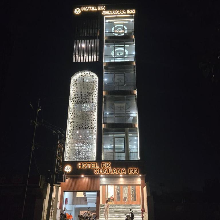 a tall building with a sign in front of it at Hotel RK Gharana Inn in Siwān
