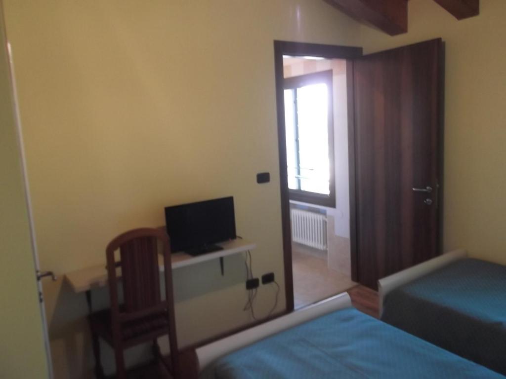 Postel nebo postele na pokoji v ubytování Agriturismo La Prateria