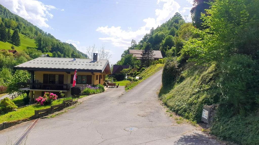 a road leading to a house on a hill at La Staulette in Queige