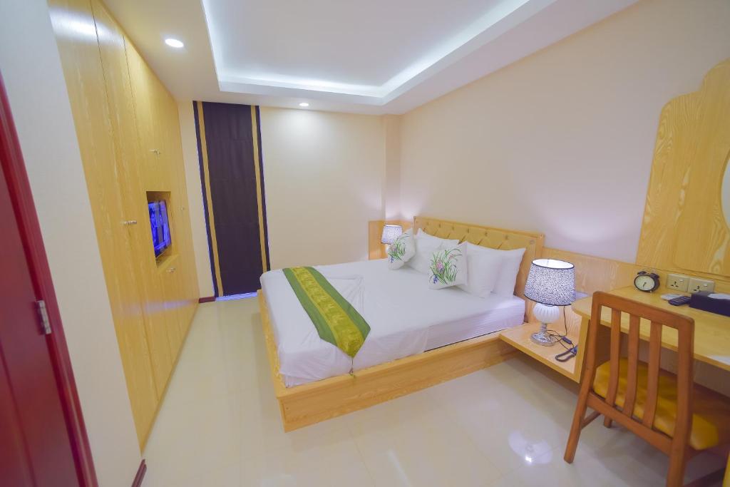 Postel nebo postele na pokoji v ubytování Hathaa Beach Maldives