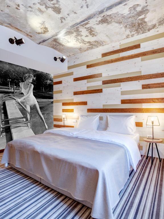 Postel nebo postele na pokoji v ubytování Garni Hotel Zavicaj