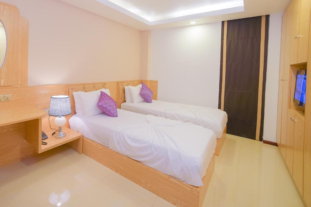 Postel nebo postele na pokoji v ubytování Hathaa Beach Maldives