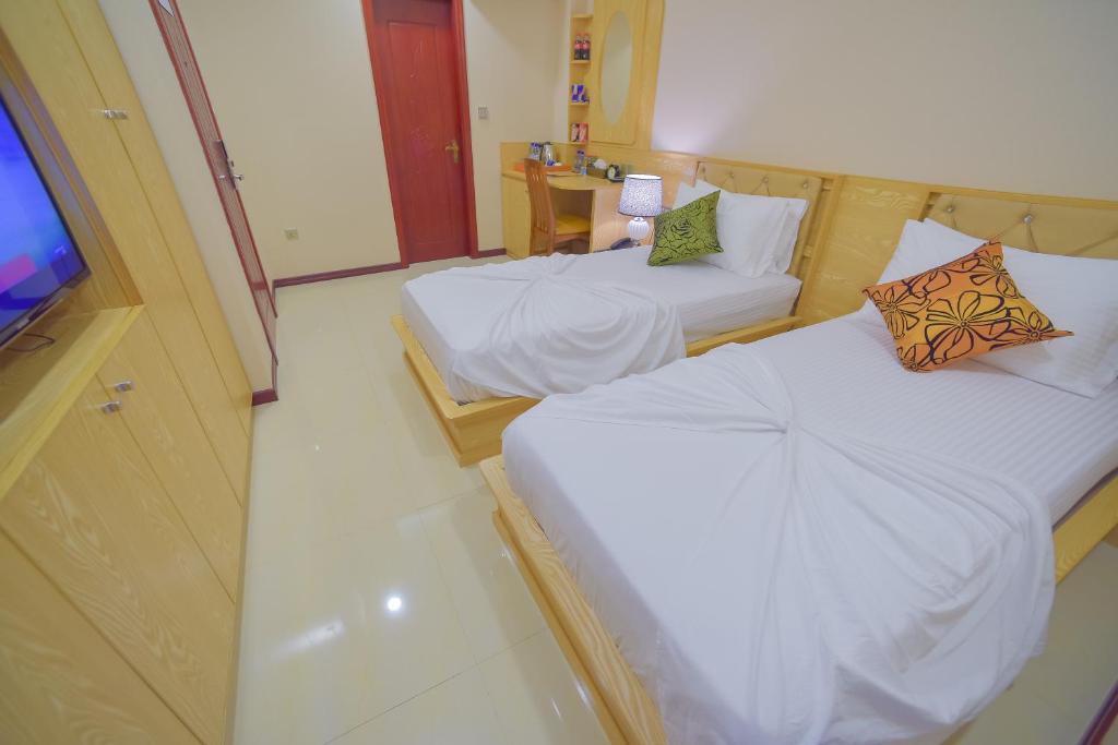 Postel nebo postele na pokoji v ubytování Hathaa Beach Maldives