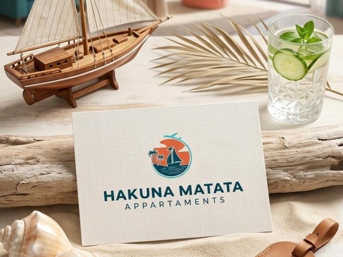 a sign on a table with a miniature ship on it at HAKUNA MATATA Elegant Apartment in Central Taranto in Taranto