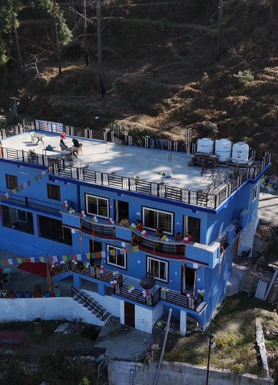 a large blue boat with people on the deck at The City View Homestay in Srīnagar