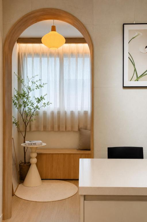 a living room with a table and a window at Euljiro Central 3BR Stay in Seoul