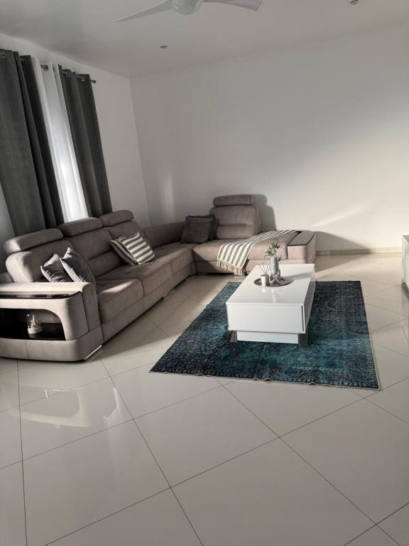 a living room with a couch and a coffee table at Casa Amélia in Cidade Velha