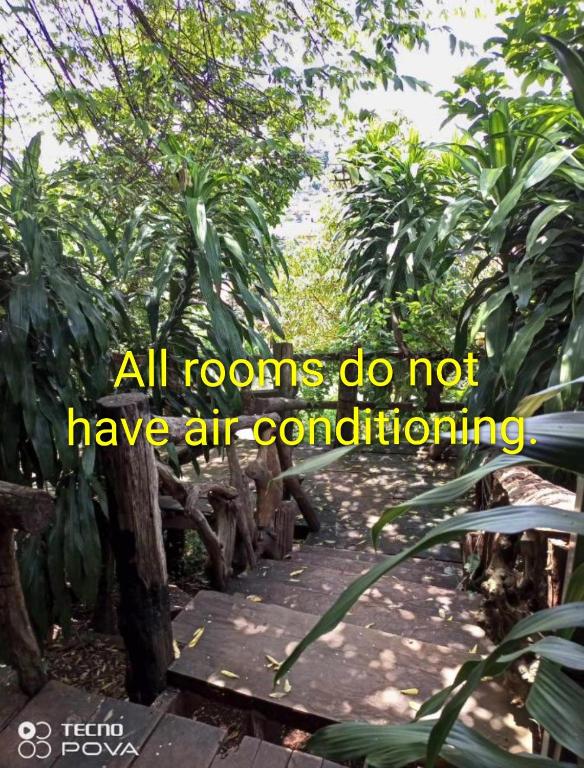 a sign that says all rooms do not have air conditioning at FamilyHouse & Trekking in Banlung