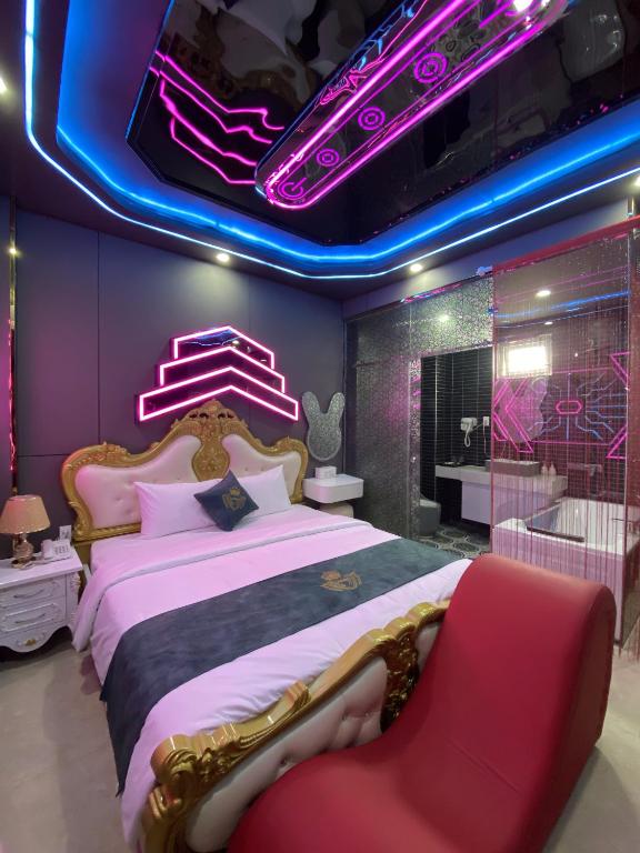 a bedroom with a large bed and a purple ceiling at Haven Hotel in Ho Chi Minh City