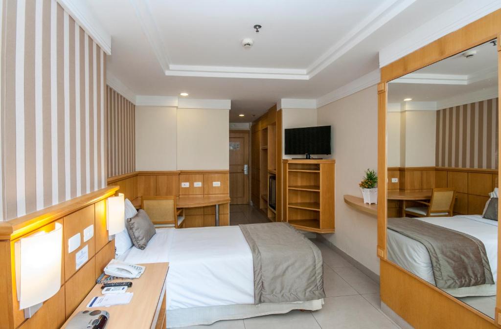 Кровать или кровати в номере Hotel Astoria Palace