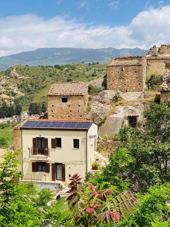 a building on a hill with buildings on it at lacasetta98 in Sperlinga