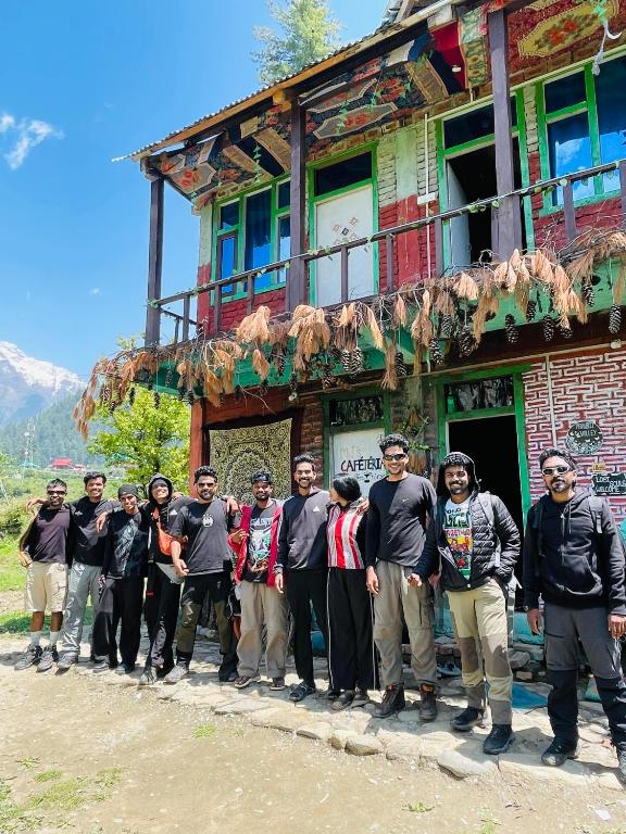 a group of people standing in front of a building at Mj s Home in Kalgha