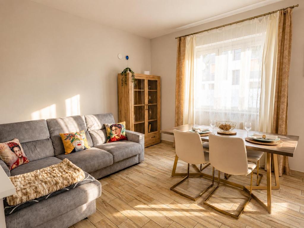 a living room with a couch and a table at Oasi Domese Appartamento Centrale in Domodossola