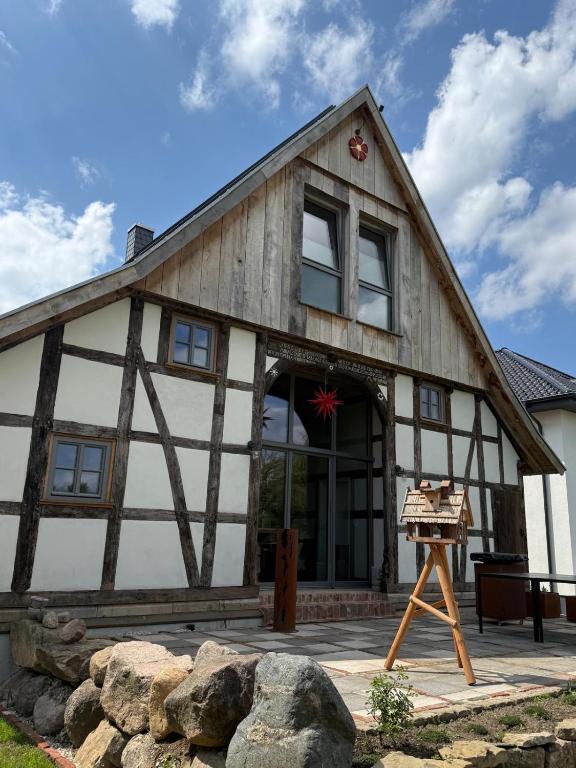 a large wooden house with a sign in front of it at Fachwerk Anno 1789 in Lemgo