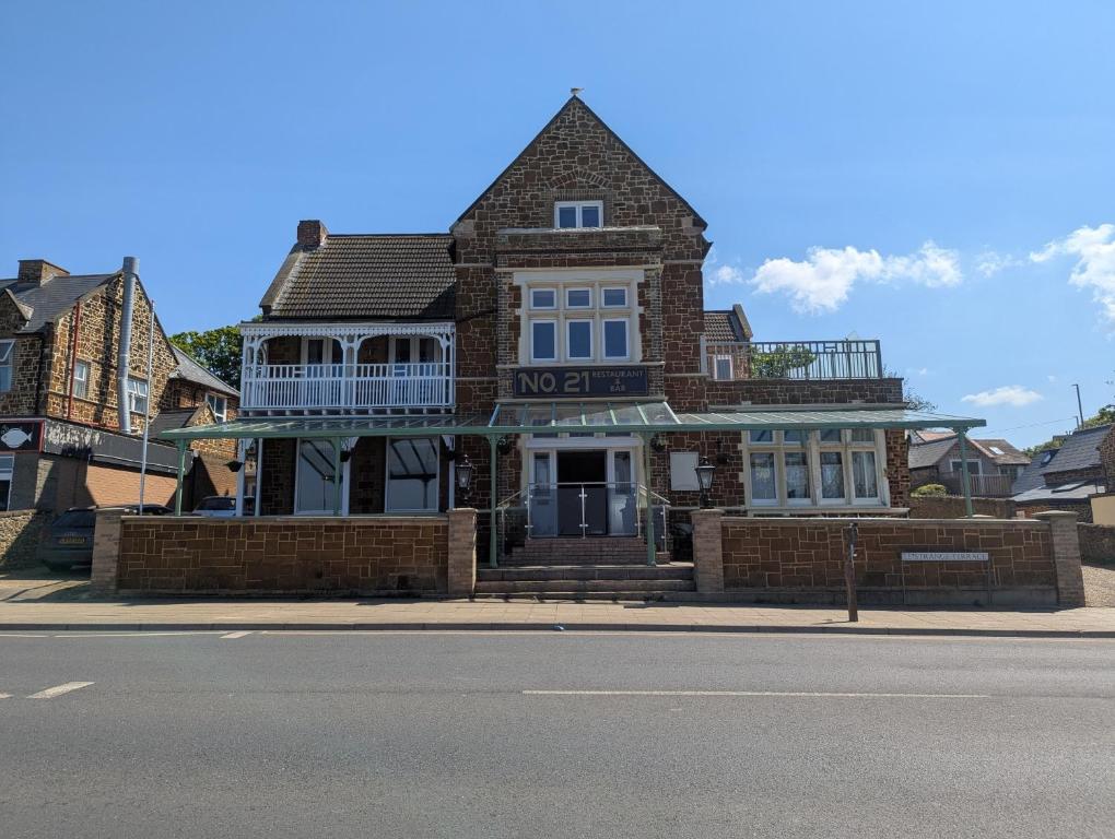 an old brick house on the side of the street at Bar 21 in Hunstanton