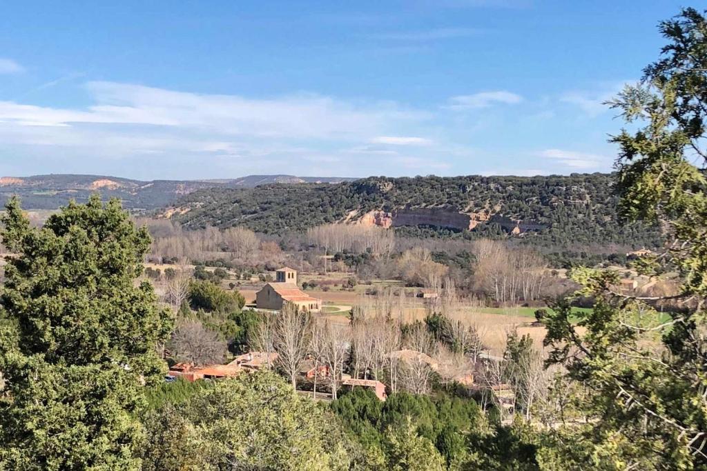 a view of a valley with trees and houses at La Tejera de Fausto in Requijada