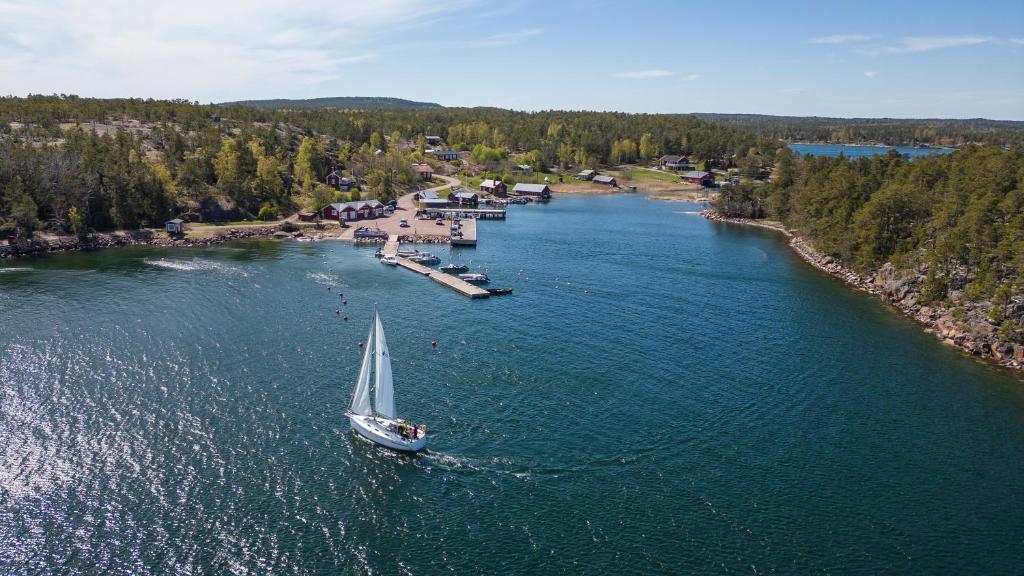 an aerial view of a sail boat on a river at Your cottege by the sea in Saltvik
