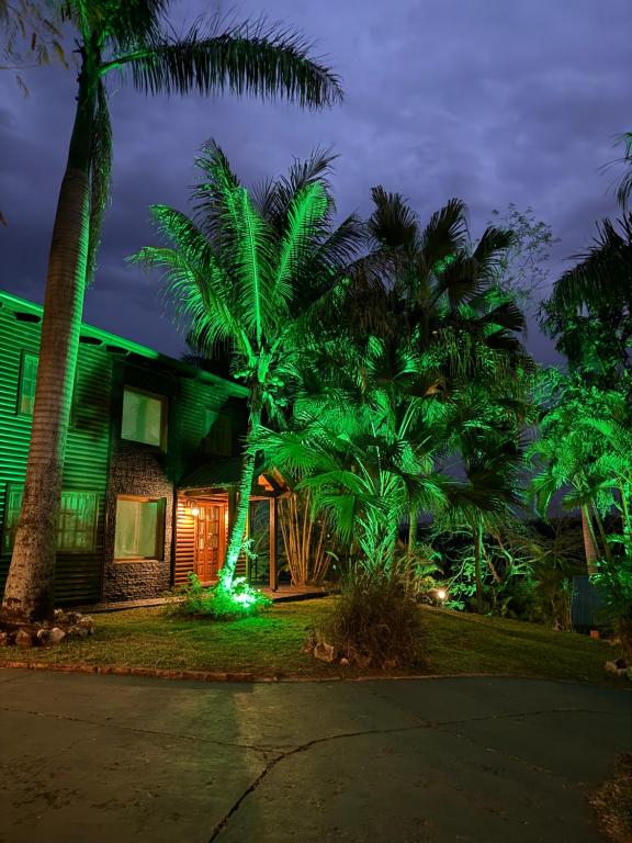 a house with green lights in front of it at Costa del Sol Iguazú in Puerto Iguazú