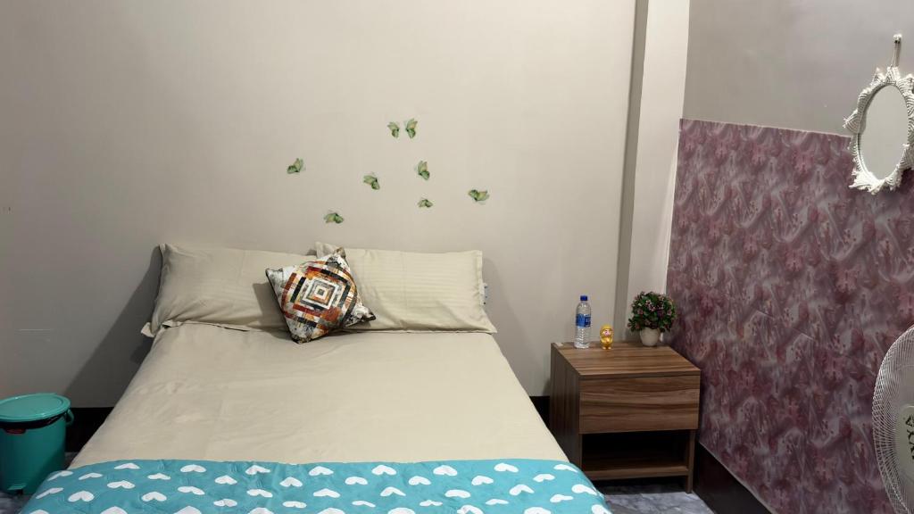 a small bedroom with a bed with at The Glory Apartment room 2 in Imphal