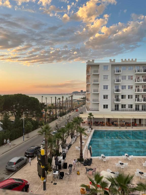 a view of a hotel with a swimming pool at Golem Apartments in Golem