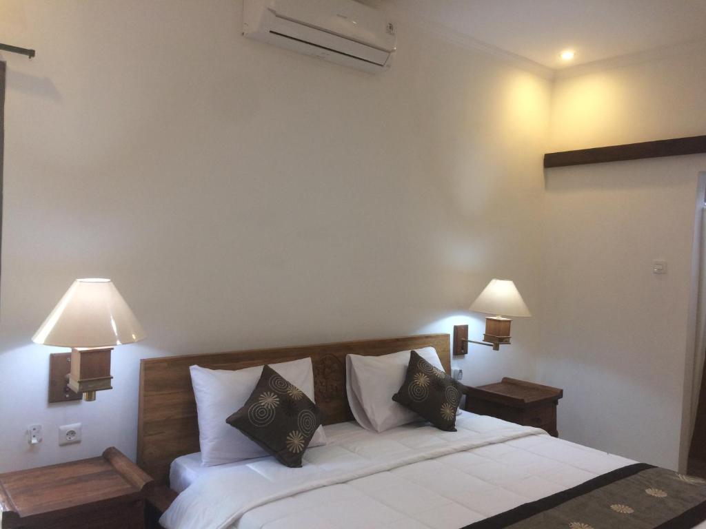 Postel nebo postele na pokoji v ubytování Ubud Rooms B&B