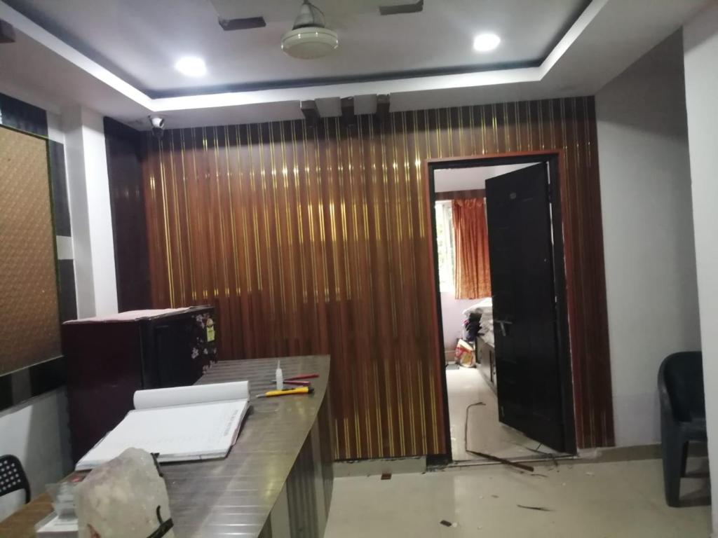 an office with a door that is being remodeled at HOTEL BPR RESIDENCy in Hyderabad