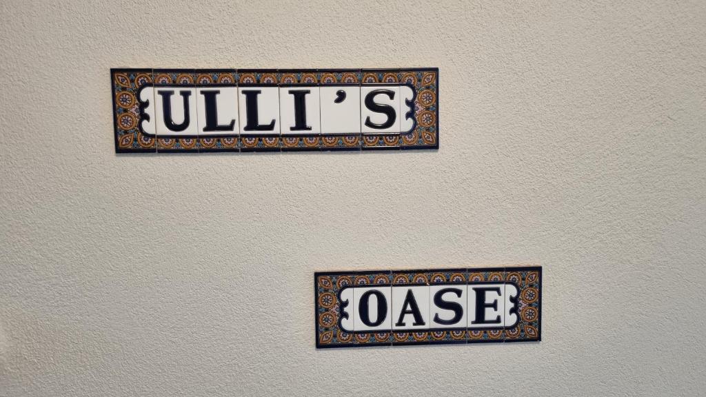 a sign on a wall that says julius noise at Ulli's Oase in Uettingen