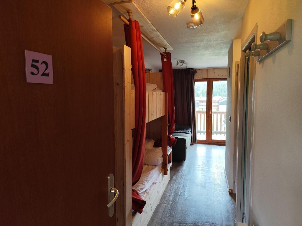 a room with a room with bunk beds in it at Marla 52 in Le Dévoluy