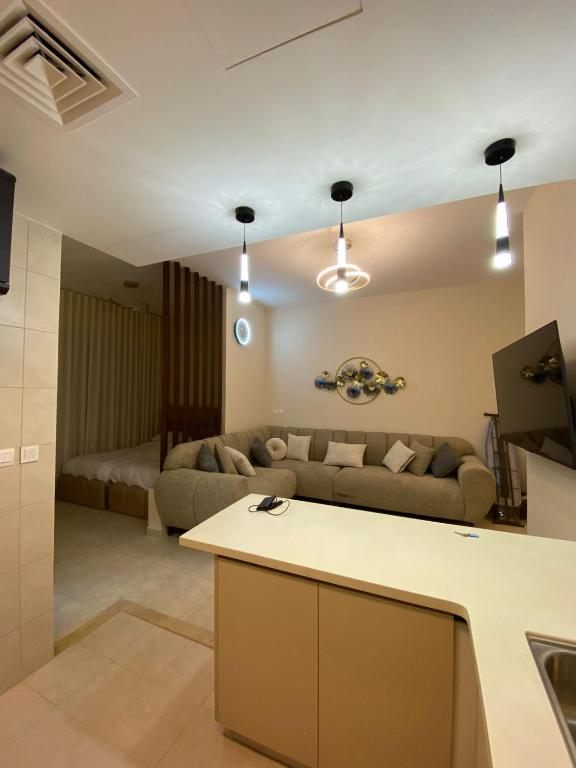 a living room with a couch and a table at Alraha Resort in Aqaba