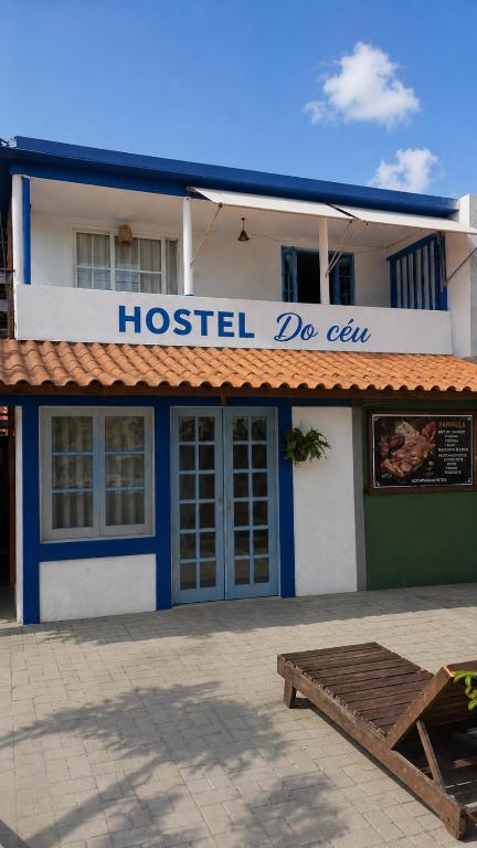 a hostel do exit with a bench in front of it at Aura House Búzios in Búzios