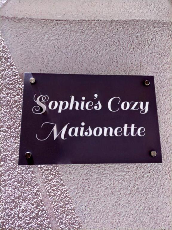 a sign on a wall that says sophies cozy mathematics at Sophie's Cozy Maisonette in Mytilinioí