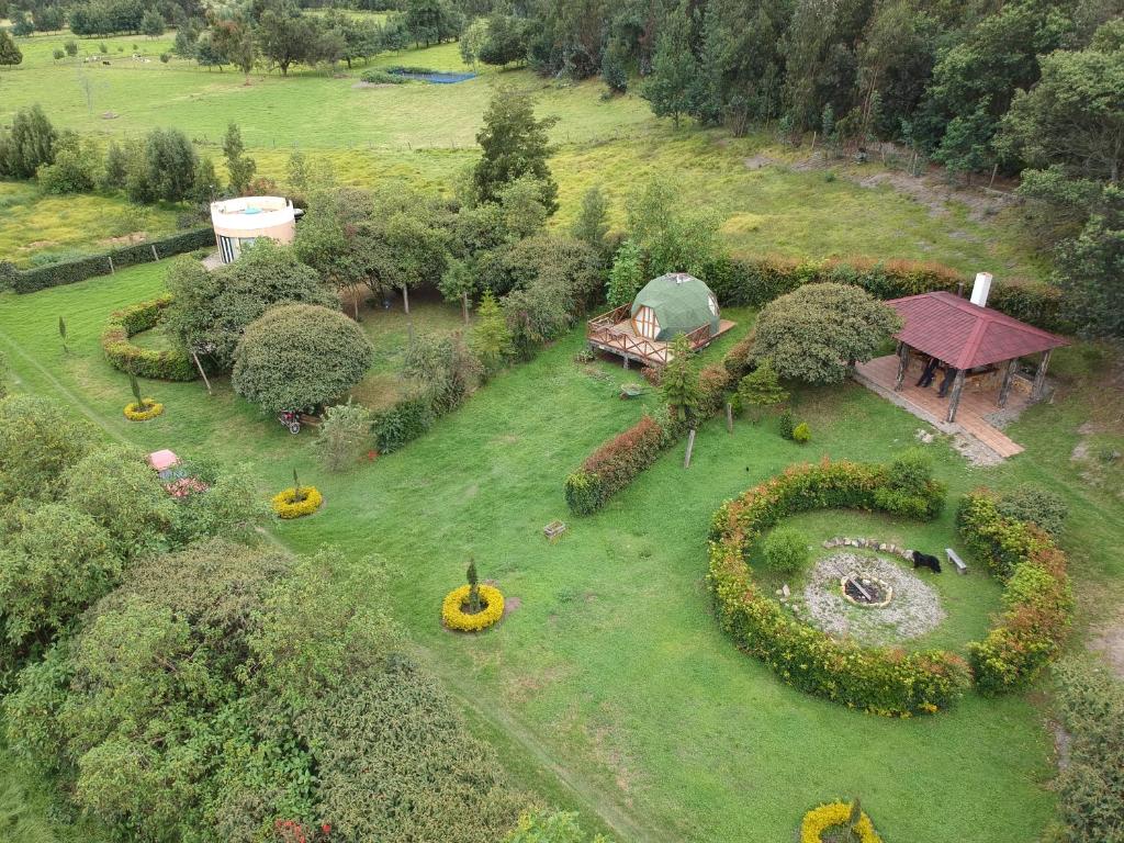 an aerial view of a garden with a circular yard at Glamping&BBQ San José - Susa Cundinamarca in Susa