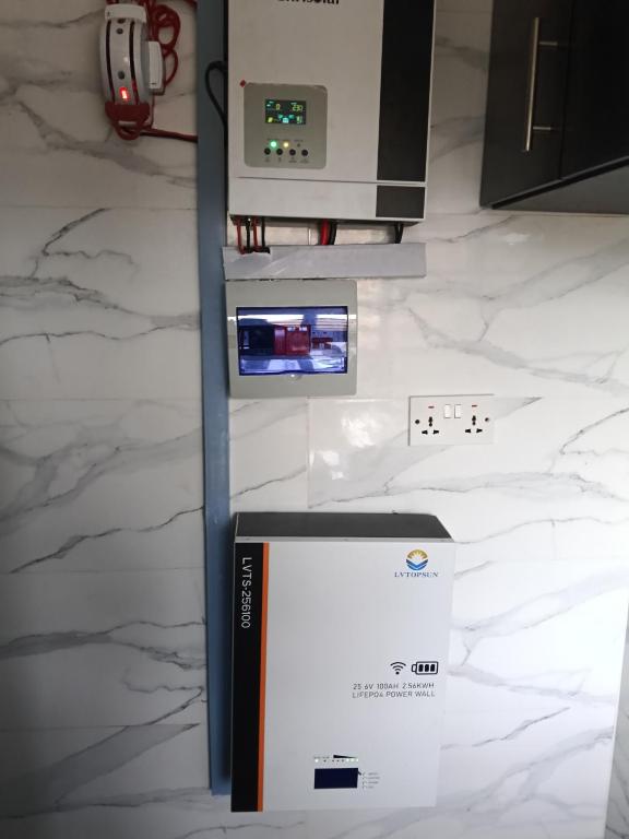 a gas station with a box next to a counter at Bec property in Ikorodu